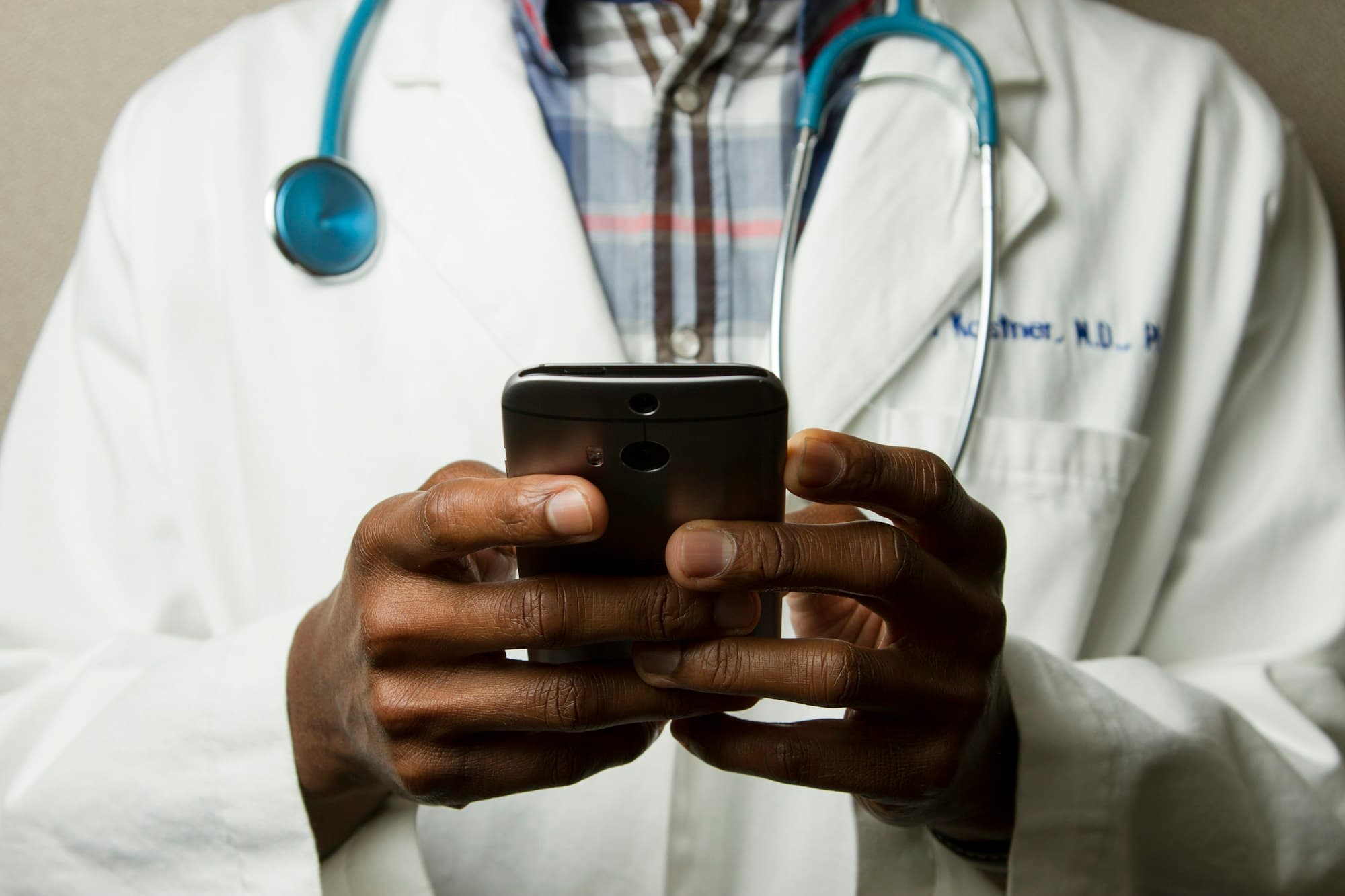 A doctor holding a stethoscope, ready to care for patients