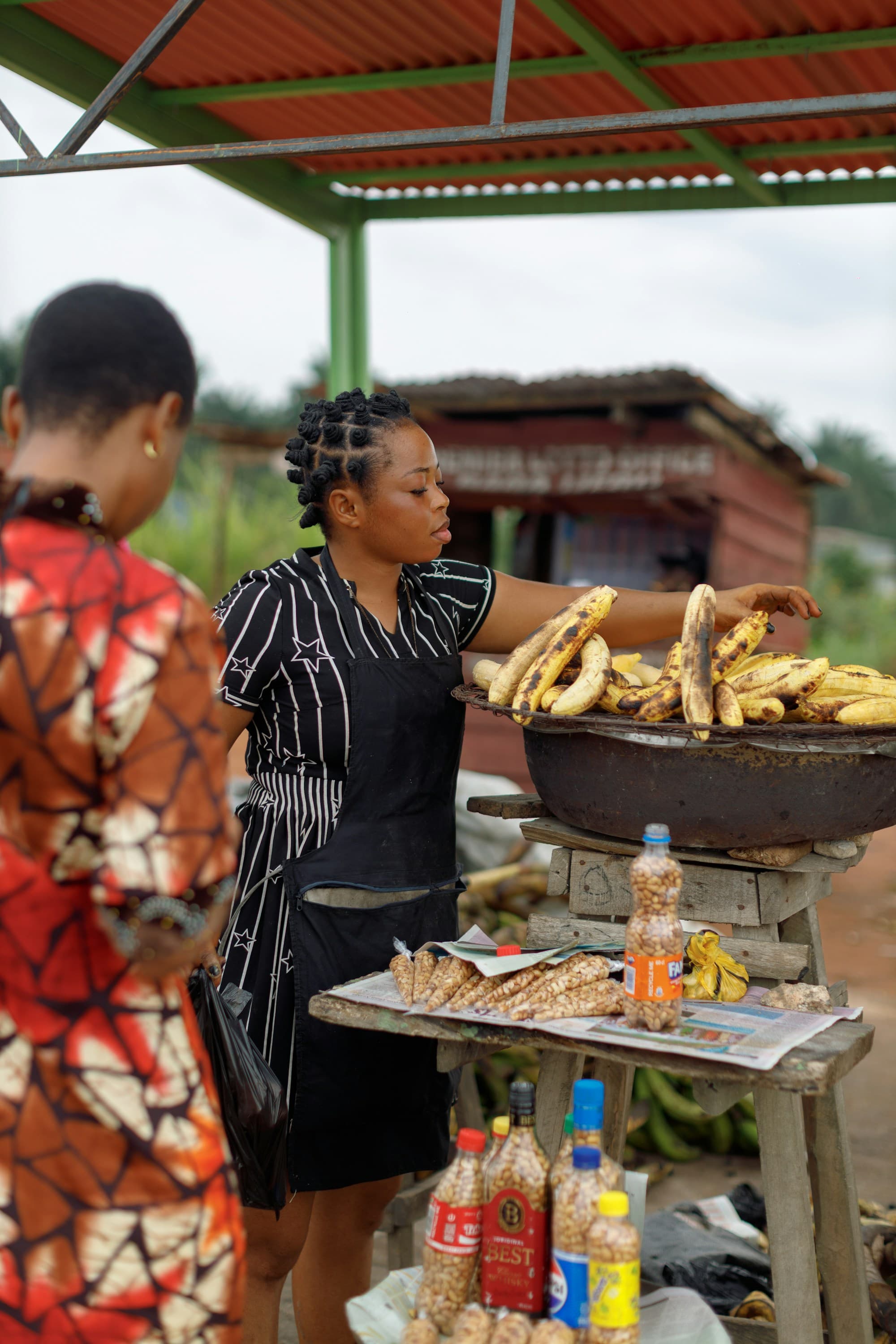 A Nigerian woman running her small market stall